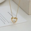 A large heart-shaped pendant with a hollow texture and a small heart embedded inside has a golden texture and a romantic atmosphere Specification image